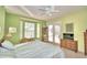 Green-walled bedroom with king bed, and sliding doors to patio at 132 Lake Region Cir, Winter Haven, FL 33881