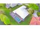Aerial view of house with private pool and lush landscaping at 132 Lake Region Cir, Winter Haven, FL 33881