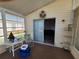 Bright sunroom with access to the outdoors and a ceiling fan at 17 Edinburgh Dr, Haines City, FL 33844