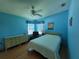 Light and airy bedroom with a ceiling fan and ample closet space at 17 Edinburgh Dr, Haines City, FL 33844