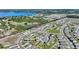 Aerial view of a residential area with homes and a nearby lake at 856 Sun Burst Rd, Winter Haven, FL 33880