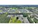 High-angle shot of a residential community, featuring houses and surrounding landscape at 856 Sun Burst Rd, Winter Haven, FL 33880
