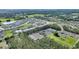 Aerial view of a residential neighborhood with a mix of houses and green spaces at 856 Sun Burst Rd, Winter Haven, FL 33880