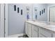 Dual vanity bathroom with white cabinetry and modern fixtures at 856 Sun Burst Rd, Winter Haven, FL 33880