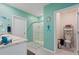 Bright bathroom with dual vanities, walk-in shower, and separate toilet area at 856 Sun Burst Rd, Winter Haven, FL 33880