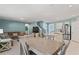 Dining area with a wooden table and chairs, open to the living room and kitchen at 856 Sun Burst Rd, Winter Haven, FL 33880