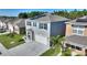 Aerial view of home with solar panels, blue shutters, and driveway at 856 Sun Burst Rd, Winter Haven, FL 33880