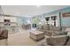 Open-concept living area with comfortable seating, a dining table, and a view of the backyard at 856 Sun Burst Rd, Winter Haven, FL 33880