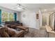 Comfortable living room with plush seating, a ceiling fan, and neutral walls at 856 Sun Burst Rd, Winter Haven, FL 33880
