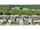 Several homes with solar panels, green lawns and driveways at 856 Sun Burst Rd, Winter Haven, FL 33880