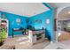 Home office space with vibrant decor, a large desk, and open shelving at 856 Sun Burst Rd, Winter Haven, FL 33880