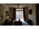 Living room with sofa, TV, and sliding glass doors to balcony at 8010 Tuscany Way # 5308, Davenport, FL 33896