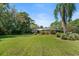 Landscaped front yard showcasing a single-story home with lush greenery at 6168 Arborea Dr, Lake Wales, FL 33898