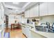 Cozy kitchen boasts ample counter space, a built-in breakfast nook, and modern appliances at 6168 Arborea Dr, Lake Wales, FL 33898