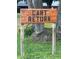 Wooden sign indicating the cart return area at 680 Augusta Rd, Winter Haven, FL 33884