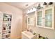 Bathroom with vanity, storage, and shower/tub combo at 4920 Old Lucerne Park Ne Rd, Winter Haven, FL 33881
