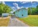 Charming light blue house with a spacious yard, located by the lake at 4920 Old Lucerne Park Ne Rd, Winter Haven, FL 33881
