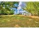 Large yard with a detached garage and a view of the house from afar at 4920 Old Lucerne Park Ne Rd, Winter Haven, FL 33881