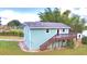 Light blue house with a wooden deck and stairs at 4920 Old Lucerne Park Ne Rd, Winter Haven, FL 33881