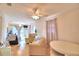 Open living area with seating, hardwood floors and access to a deck at 4920 Old Lucerne Park Ne Rd, Winter Haven, FL 33881