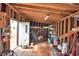 Spacious workshop with wooden shelving, a workbench and a table at 4920 Old Lucerne Park Ne Rd, Winter Haven, FL 33881