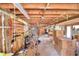 Unfinished basement with shelving and storage boxes at 4920 Old Lucerne Park Ne Rd, Winter Haven, FL 33881