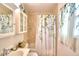 Updated bathroom with a shower/tub, vanity and storage at 4920 Old Lucerne Park Ne Rd, Winter Haven, FL 33881