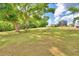 Large yard with a detached garage and a view of the house from afar at 4920 Old Lucerne Park Ne Rd, Winter Haven, FL 33881