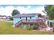 Aerial view of a charming light blue house with a deck at 4920 Old Lucerne Park Ne Rd, Winter Haven, FL 33881