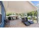 Covered patio overlooking the lake with lounge chairs at 1396 Lucerne Loop Ne Rd, Winter Haven, FL 33881