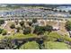 Neighborhood view showing home near lake at 1396 Lucerne Loop Ne Rd, Winter Haven, FL 33881