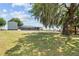 Large backyard with shed and playset at 1396 Lucerne Loop Ne Rd, Winter Haven, FL 33881