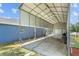 Metal carport with concrete floor and storage at 1396 Lucerne Loop Ne Rd, Winter Haven, FL 33881