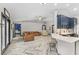 Open concept living room and kitchen with herringbone floors at 1396 Lucerne Loop Ne Rd, Winter Haven, FL 33881