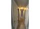 Bright hallway with tile floors and multiple doors at 152 E Grove Dr, Haines City, FL 33844