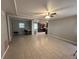 Spacious living room with tile floors and kitchen view at 152 E Grove Dr, Haines City, FL 33844