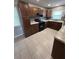Updated kitchen featuring wood cabinets and tile flooring at 152 E Grove Dr, Haines City, FL 33844
