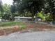 Gray house exterior with screened porch and fenced yard at 152 E Grove Dr, Haines City, FL 33844