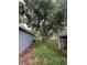 Large backyard with mature trees and shed at 152 E Grove Dr, Haines City, FL 33844