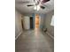 Bedroom with private bath access and tile floors at 152 E Grove Dr, Haines City, FL 33844