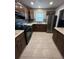 Modern kitchen with stainless steel appliances and wood cabinets at 152 E Grove Dr, Haines City, FL 33844