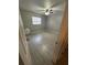 Well-lit bedroom, tile floors, and ceiling fan at 152 E Grove Dr, Haines City, FL 33844