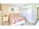 Bedroom with queen-size bed and double door closet at 1608 Forest Hills Ln, Haines City, FL 33844