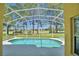 Inviting screened pool with golf course view at 1608 Forest Hills Ln, Haines City, FL 33844