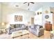Comfortable living room with two gray sofas and a coffee table at 1608 Forest Hills Ln, Haines City, FL 33844