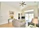 Living room with gray sofas,sliding glass doors, and pool view at 1608 Forest Hills Ln, Haines City, FL 33844