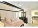 Main bedroom with dark wood canopy bed and dresser at 1608 Forest Hills Ln, Haines City, FL 33844