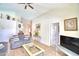 Living room with gray sofas, coffee table, and view of hallway at 1608 Forest Hills Ln, Haines City, FL 33844