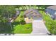 House with driveway and landscaped yard at 1608 Forest Hills Ln, Haines City, FL 33844