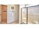 Bathroom with shower stall, walk-in closet, and tile floor at 1608 Forest Hills Ln, Haines City, FL 33844